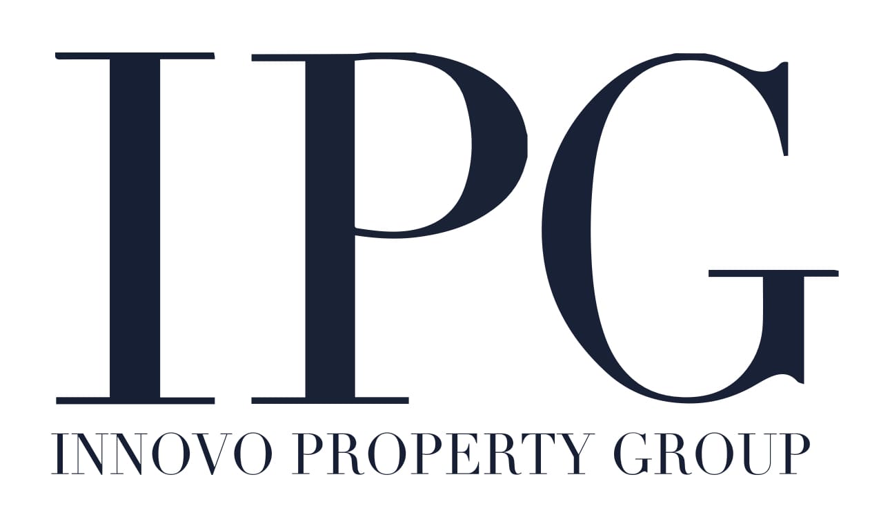 Close-up of a logo with large letters and smaller text beneath.